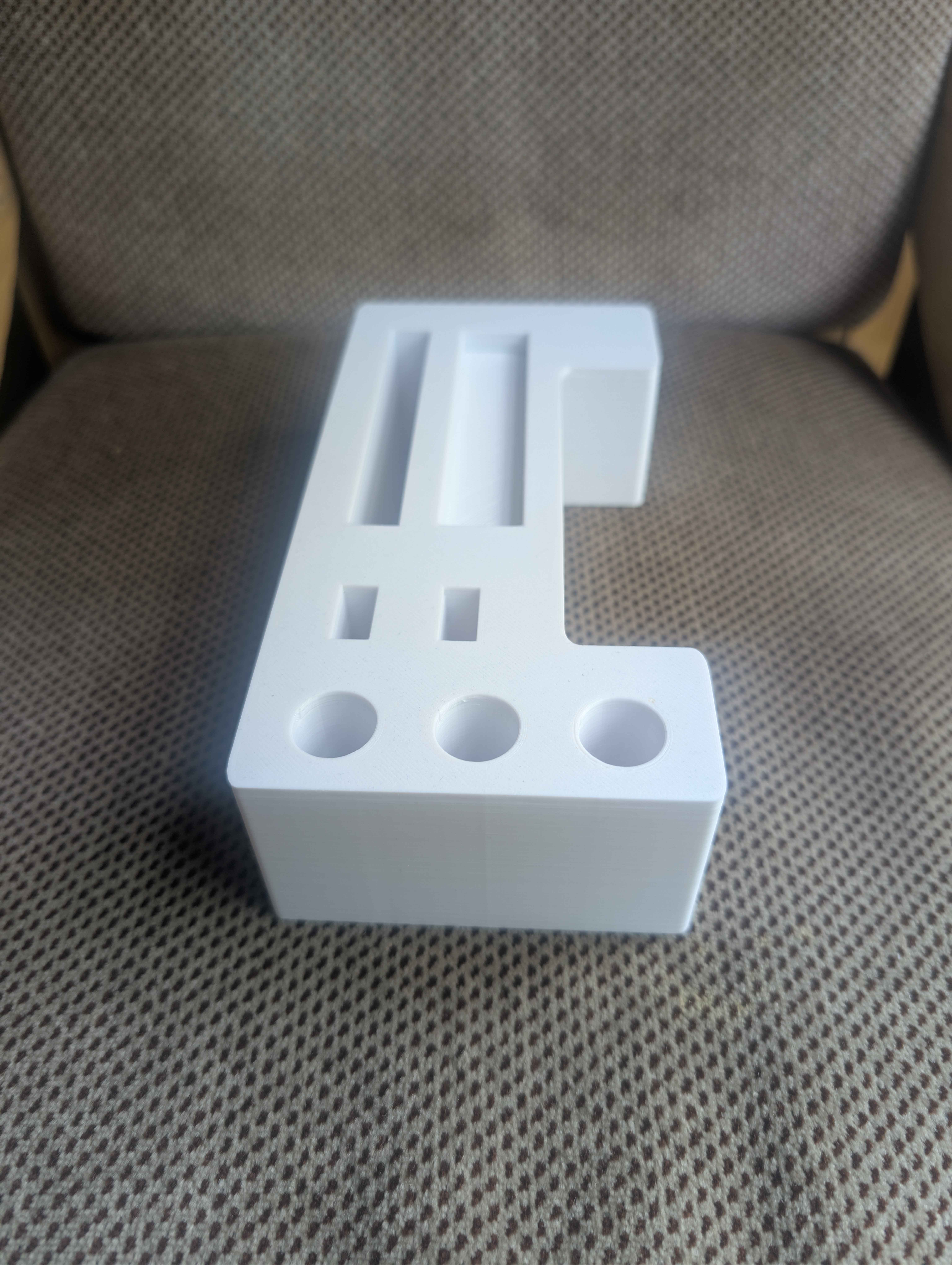 White PETG organizer with recessed pockets and circular holes